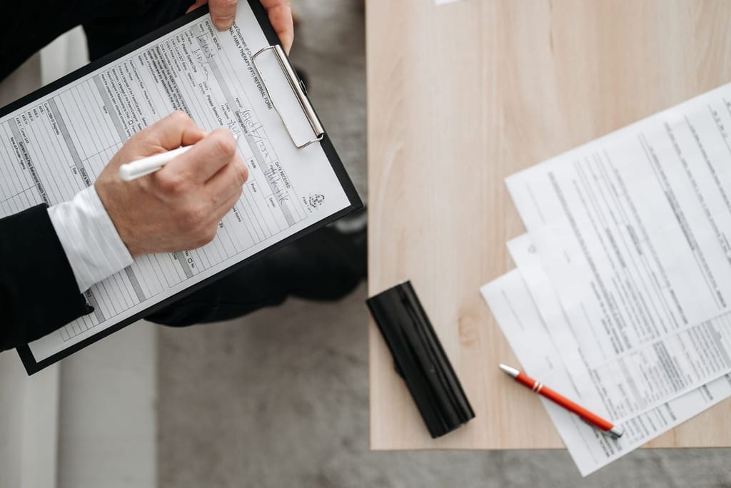 Model Exorex 100: paperwork spread across a desk