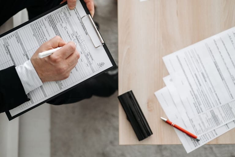 Model Exorex 100: paperwork spread across a desk