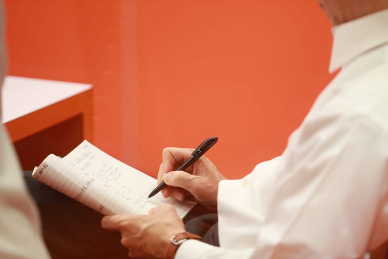 Slide +Lab Codrix: a notebook and pen on a desk