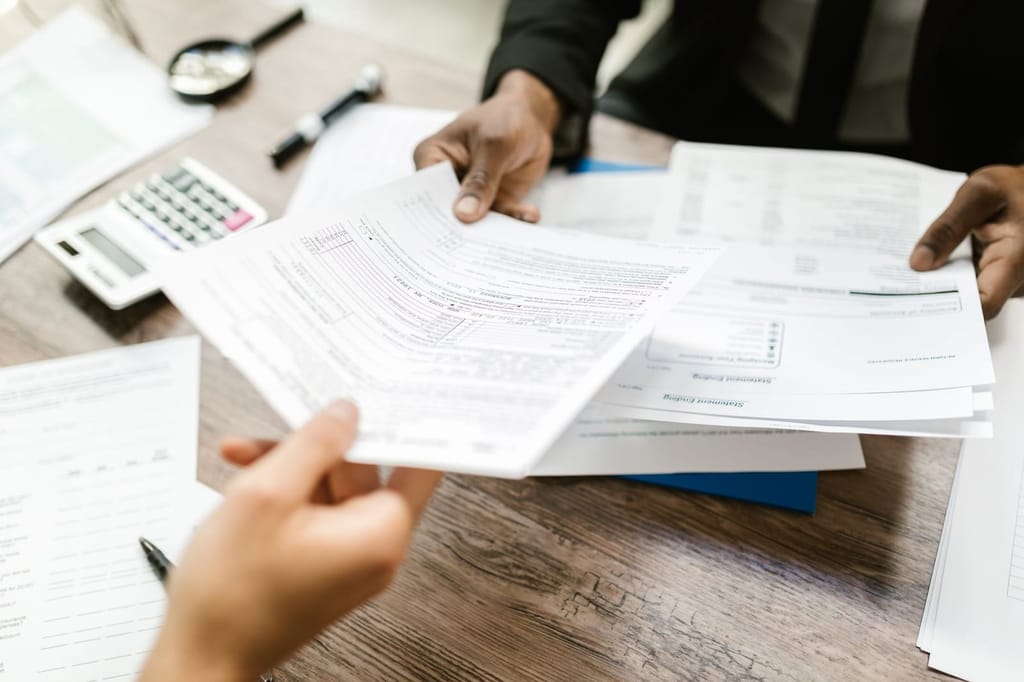 Stake Maxalt 100: paperwork spread across a desk