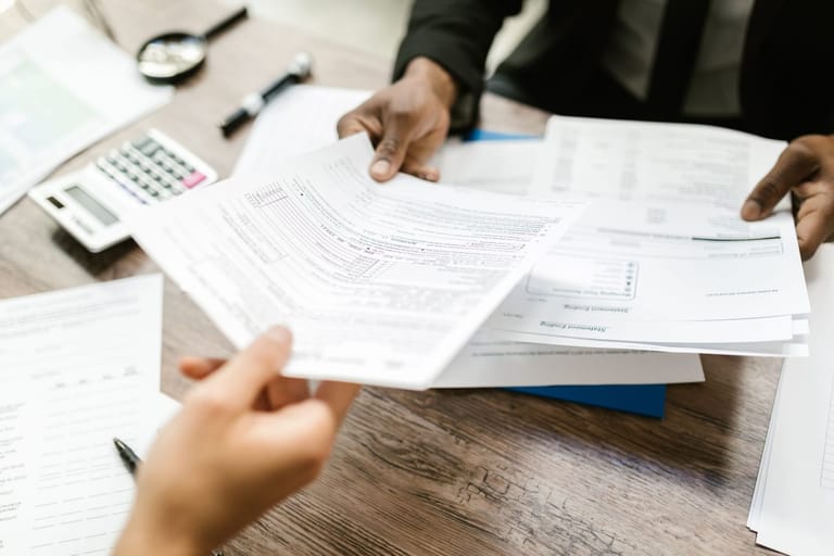 Stake Maxalt 100: paperwork spread across a desk